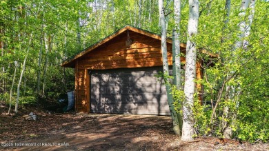 Experience the charm of rustic elegance at 590 Walnut Drive on Star Valley RV Golf Course in Wyoming - for sale on GolfHomes.com, golf home, golf lot