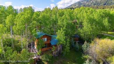 Experience the charm of rustic elegance at 590 Walnut Drive on Star Valley RV Golf Course in Wyoming - for sale on GolfHomes.com, golf home, golf lot
