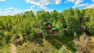 Experience the charm of rustic elegance at 590 Walnut Drive on Star Valley RV Golf Course in Wyoming - for sale on GolfHomes.com, golf home, golf lot