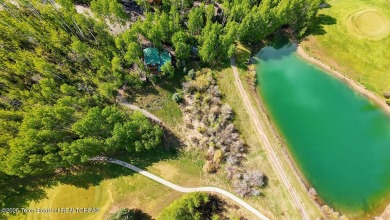 Experience the charm of rustic elegance at 590 Walnut Drive on Star Valley RV Golf Course in Wyoming - for sale on GolfHomes.com, golf home, golf lot