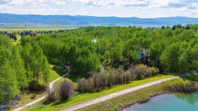 Experience the charm of rustic elegance at 590 Walnut Drive on Star Valley RV Golf Course in Wyoming - for sale on GolfHomes.com, golf home, golf lot