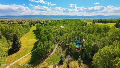Experience the charm of rustic elegance at 590 Walnut Drive on Star Valley RV Golf Course in Wyoming - for sale on GolfHomes.com, golf home, golf lot