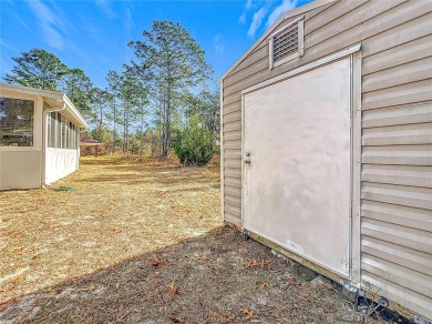 Welcome to this charming 3 bedroom, 2 bath, 2 car garage home on Citrus Springs Country Club in Florida - for sale on GolfHomes.com, golf home, golf lot