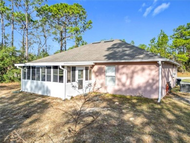 Welcome to this charming 3 bedroom, 2 bath, 2 car garage home on Citrus Springs Country Club in Florida - for sale on GolfHomes.com, golf home, golf lot