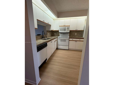 c Located on the 2nd floor of an elevator building, this unit on Flamingo Lakes Country Club in Florida - for sale on GolfHomes.com, golf home, golf lot