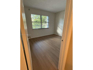 c Located on the 2nd floor of an elevator building, this unit on Flamingo Lakes Country Club in Florida - for sale on GolfHomes.com, golf home, golf lot