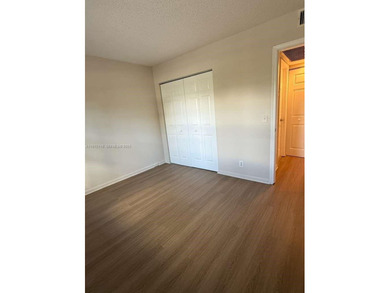 c Located on the 2nd floor of an elevator building, this unit on Flamingo Lakes Country Club in Florida - for sale on GolfHomes.com, golf home, golf lot