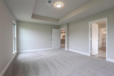 This traditional ranch-style new home is complemented by a on Heritage Park Golf Course in Kansas - for sale on GolfHomes.com, golf home, golf lot