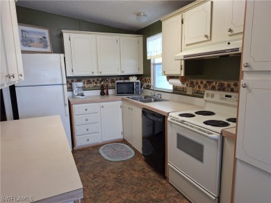PRICE JUST REDUCED $15,000 - THIS OPEN CONCEPT FLOOR PLAN 1989 on Six Lakes Country Club in Florida - for sale on GolfHomes.com, golf home, golf lot