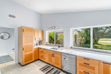 Beautiful golf course views surround this bright and inviting on Indian Spring Golf and Country Club in Florida - for sale on GolfHomes.com, golf home, golf lot