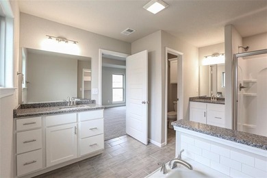 This traditional ranch-style new home is complemented by a on Heritage Park Golf Course in Kansas - for sale on GolfHomes.com, golf home, golf lot