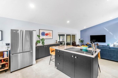 Beautiful golf course views surround this bright and inviting on Indian Spring Golf and Country Club in Florida - for sale on GolfHomes.com, golf home, golf lot