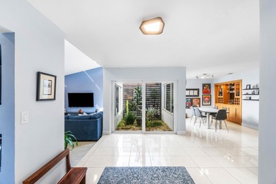 Beautiful golf course views surround this bright and inviting on Indian Spring Golf and Country Club in Florida - for sale on GolfHomes.com, golf home, golf lot