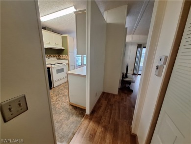 PRICE JUST REDUCED $15,000 - THIS OPEN CONCEPT FLOOR PLAN 1989 on Six Lakes Country Club in Florida - for sale on GolfHomes.com, golf home, golf lot