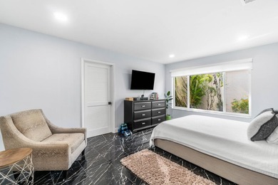 Beautiful golf course views surround this bright and inviting on Indian Spring Golf and Country Club in Florida - for sale on GolfHomes.com, golf home, golf lot