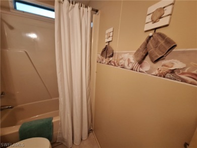 PRICE JUST REDUCED $15,000 - THIS OPEN CONCEPT FLOOR PLAN 1989 on Six Lakes Country Club in Florida - for sale on GolfHomes.com, golf home, golf lot
