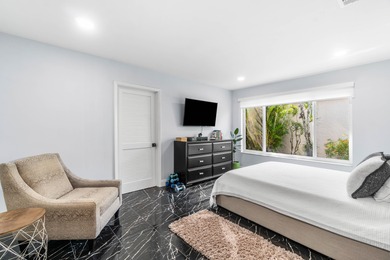 Beautiful golf course views surround this bright and inviting on Indian Spring Golf and Country Club in Florida - for sale on GolfHomes.com, golf home, golf lot