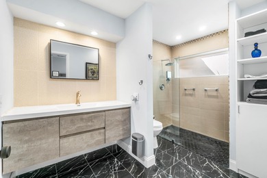 Beautiful golf course views surround this bright and inviting on Indian Spring Golf and Country Club in Florida - for sale on GolfHomes.com, golf home, golf lot