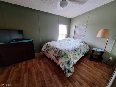 PRICE JUST REDUCED $15,000 - THIS OPEN CONCEPT FLOOR PLAN 1989 on Six Lakes Country Club in Florida - for sale on GolfHomes.com, golf home, golf lot