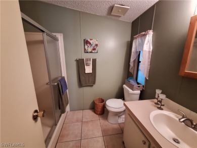 PRICE JUST REDUCED $15,000 - THIS OPEN CONCEPT FLOOR PLAN 1989 on Six Lakes Country Club in Florida - for sale on GolfHomes.com, golf home, golf lot