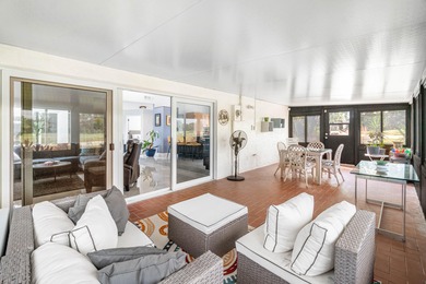 Beautiful golf course views surround this bright and inviting on Indian Spring Golf and Country Club in Florida - for sale on GolfHomes.com, golf home, golf lot