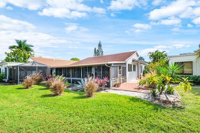 Beautiful golf course views surround this bright and inviting on Indian Spring Golf and Country Club in Florida - for sale on GolfHomes.com, golf home, golf lot
