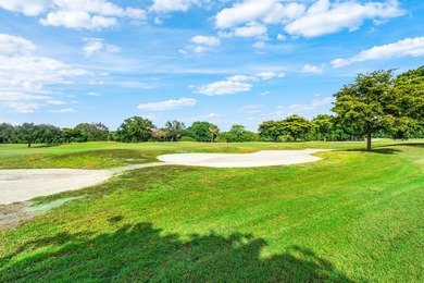 Beautiful golf course views surround this bright and inviting on Indian Spring Golf and Country Club in Florida - for sale on GolfHomes.com, golf home, golf lot