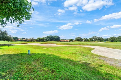 Beautiful golf course views surround this bright and inviting on Indian Spring Golf and Country Club in Florida - for sale on GolfHomes.com, golf home, golf lot