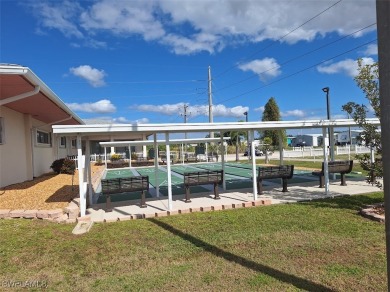 PRICE JUST REDUCED $15,000 - THIS OPEN CONCEPT FLOOR PLAN 1989 on Six Lakes Country Club in Florida - for sale on GolfHomes.com, golf home, golf lot