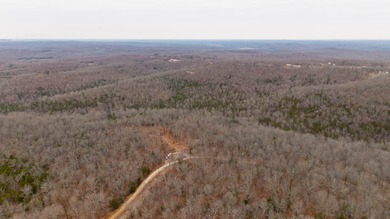 CITY CONVENIENCE MEETS UNRESTRICTED LAND IN CHEROKEE VILLAGEThis on Cherokee Village North Course in Arkansas - for sale on GolfHomes.com, golf home, golf lot
