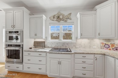 This all-brick home built in 2017 enjoys expansive pond views on Members Club At St. James Plantation in North Carolina - for sale on GolfHomes.com, golf home, golf lot