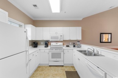 Discover this beautifully maintained top-floor condo nestled in on Barefoot Resort and Golf Club  in South Carolina - for sale on GolfHomes.com, golf home, golf lot