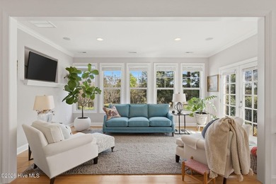 This all-brick home built in 2017 enjoys expansive pond views on Members Club At St. James Plantation in North Carolina - for sale on GolfHomes.com, golf home, golf lot