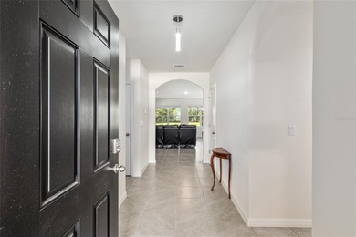 Light flows gracefully through every room of this elegant on Lake Diamond Golf and Country Club in Florida - for sale on GolfHomes.com, golf home, golf lot