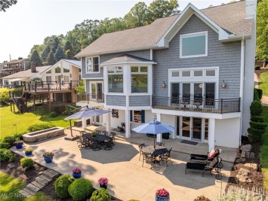 Live the lakefront dream at this exceptional 4-bedroom, 5.5-bath on Lake Mohawk Golf Club in Ohio - for sale on GolfHomes.com, golf home, golf lot