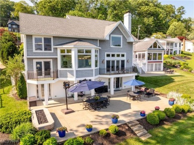 Live the lakefront dream at this exceptional 4-bedroom, 5.5-bath on Lake Mohawk Golf Club in Ohio - for sale on GolfHomes.com, golf home, golf lot