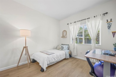 Discover comfort and convenience in this single-level end unit on Hoakalei Country Club At Ocean Pointe in Hawaii - for sale on GolfHomes.com, golf home, golf lot