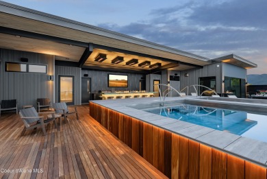 Spanning 2,950 sq. ft., this luxurious 4-bedroom, 4-bathroom on Sandpoint Elks Golf Course in Idaho - for sale on GolfHomes.com, golf home, golf lot