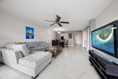 Enjoy Effortless Condo Living with Golf Course Views! Welcome to on East Bay Golf Club in Florida - for sale on GolfHomes.com, golf home, golf lot