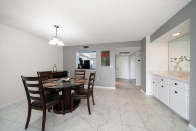 Enjoy Effortless Condo Living with Golf Course Views! Welcome to on East Bay Golf Club in Florida - for sale on GolfHomes.com, golf home, golf lot