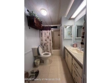 This fully furnished two-bedroom, two-bathroom house offers on High Point Golf Club, Inc. in Florida - for sale on GolfHomes.com, golf home, golf lot