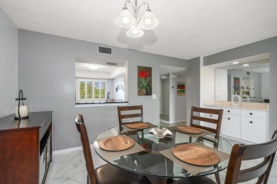 Enjoy Effortless Condo Living with Golf Course Views! Welcome to on East Bay Golf Club in Florida - for sale on GolfHomes.com, golf home, golf lot