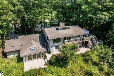 Welcome to a completely updated and enchanting 4-bedroom, 4-bath on Manitou Passage Golf Club in Michigan - for sale on GolfHomes.com, golf home, golf lot