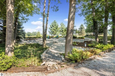 Welcome to a completely updated and enchanting 4-bedroom, 4-bath on Manitou Passage Golf Club in Michigan - for sale on GolfHomes.com, golf home, golf lot