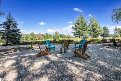 Welcome to a completely updated and enchanting 4-bedroom, 4-bath on Manitou Passage Golf Club in Michigan - for sale on GolfHomes.com, golf home, golf lot