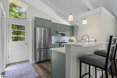 Welcome to a completely updated and enchanting 4-bedroom, 4-bath on Manitou Passage Golf Club in Michigan - for sale on GolfHomes.com, golf home, golf lot