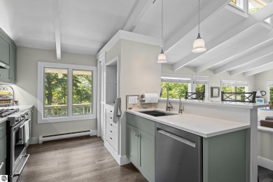 Welcome to a completely updated and enchanting 4-bedroom, 4-bath on Manitou Passage Golf Club in Michigan - for sale on GolfHomes.com, golf home, golf lot