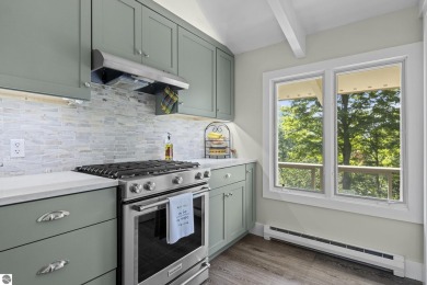 Welcome to a completely updated and enchanting 4-bedroom, 4-bath on Manitou Passage Golf Club in Michigan - for sale on GolfHomes.com, golf home, golf lot