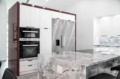 Stunning Fully Renovated 3BR + Office/4BA Pool Home in on Eastpointe Country Club in Florida - for sale on GolfHomes.com, golf home, golf lot