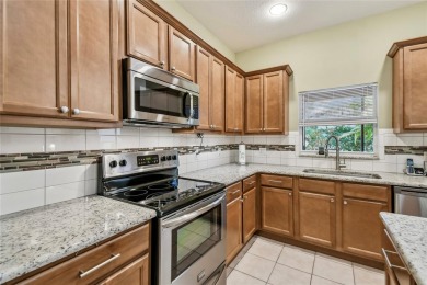 Lovely and beautifully maintained  2-bed, 2.5-bath plus a DEN on Stonegate Golf Club in Florida - for sale on GolfHomes.com, golf home, golf lot